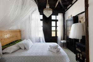 A bed or beds in a room at Antonia's House - Old town