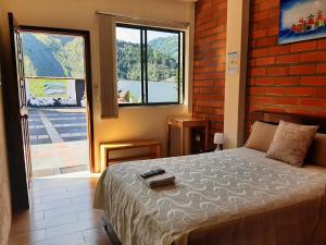 Postel nebo postele na pokoji v ubytování Hostal Monte Carmelo