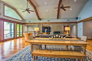 a living room with a table and a fireplace at Upscale Lakefront Texas Home Private Dock and Decks in Malakoff