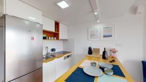 Kuchyň nebo kuchyňský kout v ubytování Villa Nono Penthouse Apartment