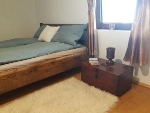 מיטה או מיטות בחדר ב-Casa de Peste Apă