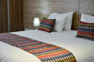 Ένα ή περισσότερα κρεβάτια σε δωμάτιο στο Alko Hotel Integrado