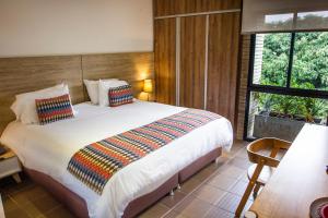 Ένα ή περισσότερα κρεβάτια σε δωμάτιο στο Alko Hotel Integrado