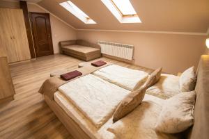 Posteľ alebo postele v izbe v ubytovaní Praktik Hotel & Restaurant