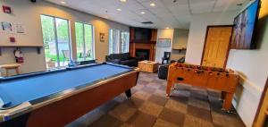 a billiard room with a pool table in it at Sunset Resorts Canmore and Spa in Canmore