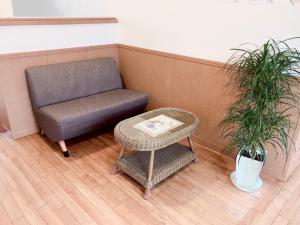 a chair and a table in a room at Joya in Ishigaki Island