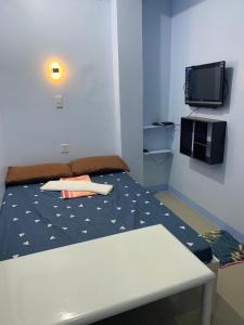 Кровать или кровати в номере RGC Residences