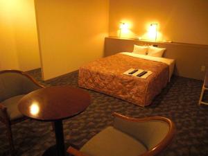 Krevet ili kreveti u jedinici u okviru objekta Main Hotel - Vacation STAY 82550