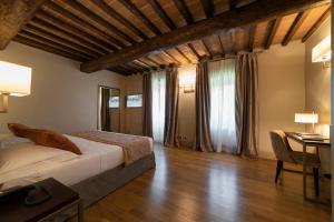 Postel nebo postele na pokoji v ubytování Relais Della Rovere