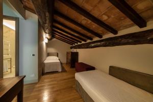 Postel nebo postele na pokoji v ubytování Relais Della Rovere