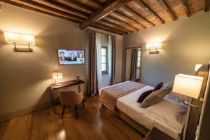 Postel nebo postele na pokoji v ubytování Relais Della Rovere