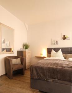 Säng eller sängar i ett rum på Schlossgartenpassage