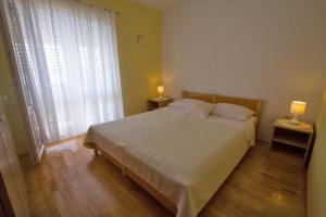 Postel nebo postele na pokoji v ubytování Apartment Domagoj