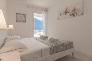 Postel nebo postele na pokoji v ubytování Apartment Azalea - Cremia