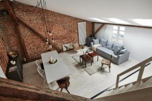 an overhead view of a living room with a brick wall at OLD NEW - Main Square in Krakow