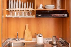 a kitchen with a sink and a counter top at Bilocale Garibaldi nel centro di Talamone in Talamone