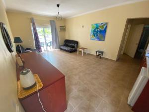 a living room with a couch and a table at Avra Sunset Sea View Liapades in Liapades