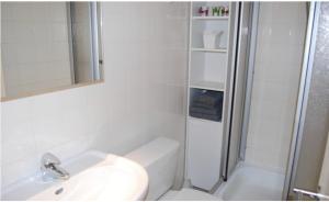 a white bathroom with a sink and a shower at Clair Vue A3 near Télécabine by Jolidi in Nendaz