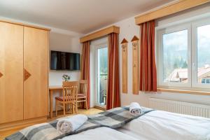 Hotel Gleimingerhof - Reiteralm tesisinde bir odada yatak veya yataklar
