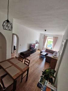 a living room with a table and a couch at Haus Nothnagl in Spitz