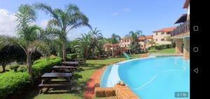 a view of a swimming pool at a resort at The Penthouse in Port Edward