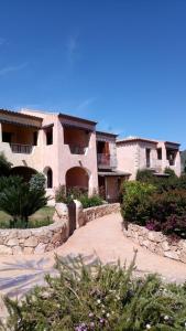 a large house with a walkway in front of it at Fiordaliso Aurora in Olbia
