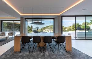 a dining room with a large table and chairs at Villa Bella in Benissa