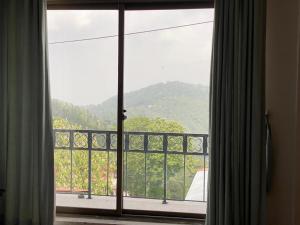 Gambar di galeri bagi Cozy Cottage at Afgan Lodge di Murree