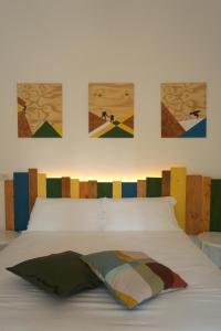 En eller flere senge i et værelse på Dimore Montane