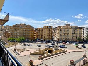 a view of a parking lot with buildings and cars at B&b Quattro Tesori in Canicattì
