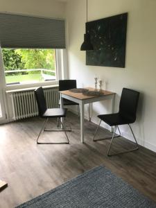 Χώρος καθιστικού στο Tiny Apartment Bad Harzburg Leihfahrräder gratis Shuttleservice