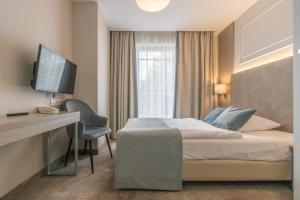 Łóżko lub łóżka w pokoju w obiekcie Villa Bravo & SPA