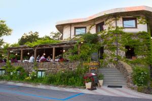 a building with a restaurant on the side of it at Costa Dorada in Cala Gonone
