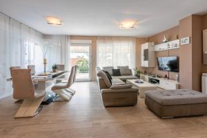 a living room with a couch and a table at Family Heritage in Crikvenica