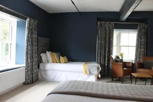 Ένα ή περισσότερα κρεβάτια σε δωμάτιο στο The Hatch Inn