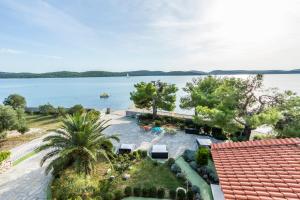 an aerial view of a resort with a body of water at Apartments Villa Punta Royal in Pirovac