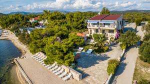 an aerial view of a house with a resort at Apartments Villa Punta Royal in Pirovac