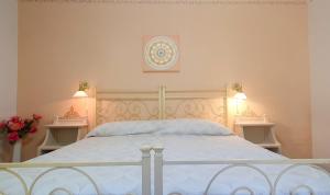 Postel nebo postele na pokoji v ubytování Agriturismo Pereti