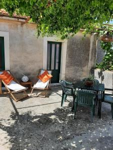 a patio with chairs and a table and chairs at STARI DVORI POLJICA in Poljica +14 photos