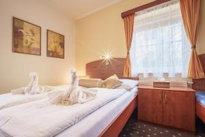 Posteľ alebo postele v izbe v ubytovaní Francis SPA HOTEL
