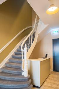 a staircase in a house with a laptop on it at FD Hotels in Rotterdam