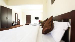Postel nebo postele na pokoji v ubytování Hotel Coffee Bean