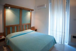 Postel nebo postele na pokoji v ubytování Albergo Miramare