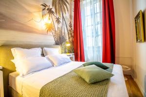 Un pat sau paturi într-o cameră la Le Belem