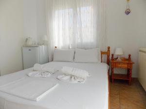 Postel nebo postele na pokoji v ubytování Hotel Sgouridis