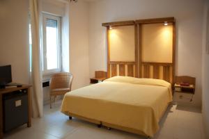 Postel nebo postele na pokoji v ubytování Albergo Miramare