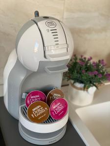 a mixer sitting on a counter next to a sink at Anna’s lovely Home in Sighişoara +9 photos
