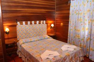 เตียงในห้องที่ Complejo Turistico Chuy