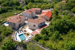 an aerial view of a house with a swimming pool at Villa Oasa in Malinska