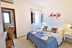 Postel nebo postele na pokoji v ubytování Loft Tropical - 100 metri dalla spiaggia di sabbia e dal mare